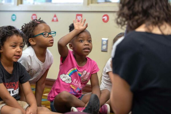 “What are the children doing with the chalk?” the teacher asks. “They’re putting it back where they found it,” Kanasia Brown says.
