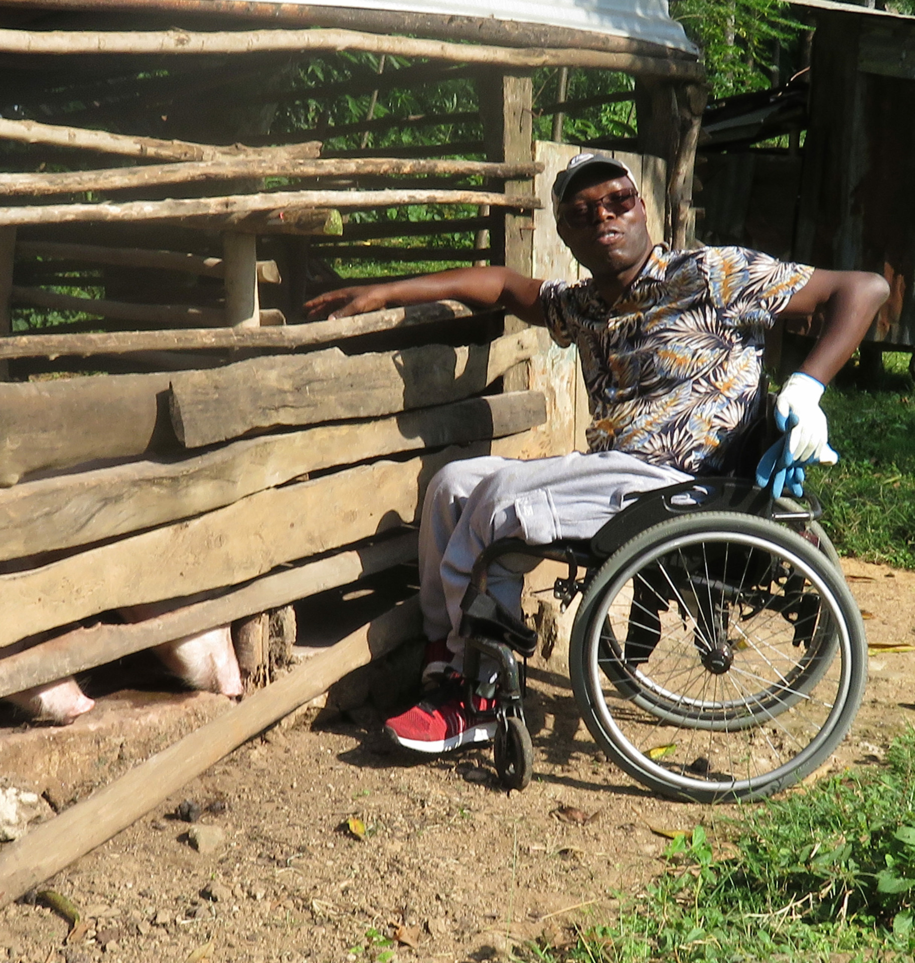 Ressa on a farm in Kenya where he works with farm families.