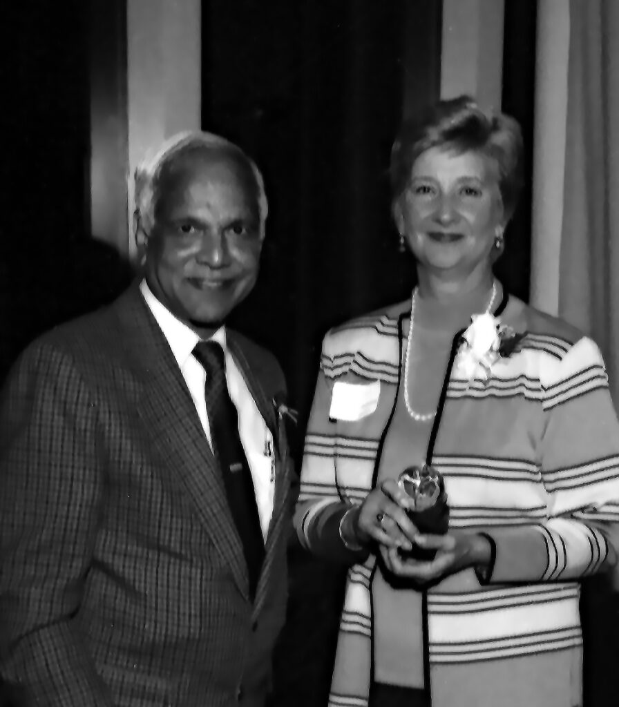 Sue Fitzsimons receiving award from her  faculty dissertation advisor Professor Ayres D'Costa