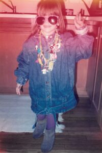 Kat Depizzo as a young girl in hand-me-down clothes