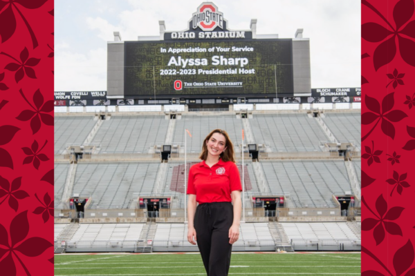 Alyssa Sharp on Ohio State football field in front of big screen