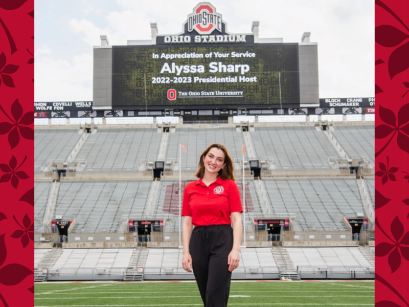 Alyssa Sharp on Ohio State football field in front of big screen