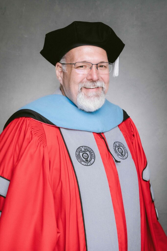 Derek Lee in Ohio State graduation robes