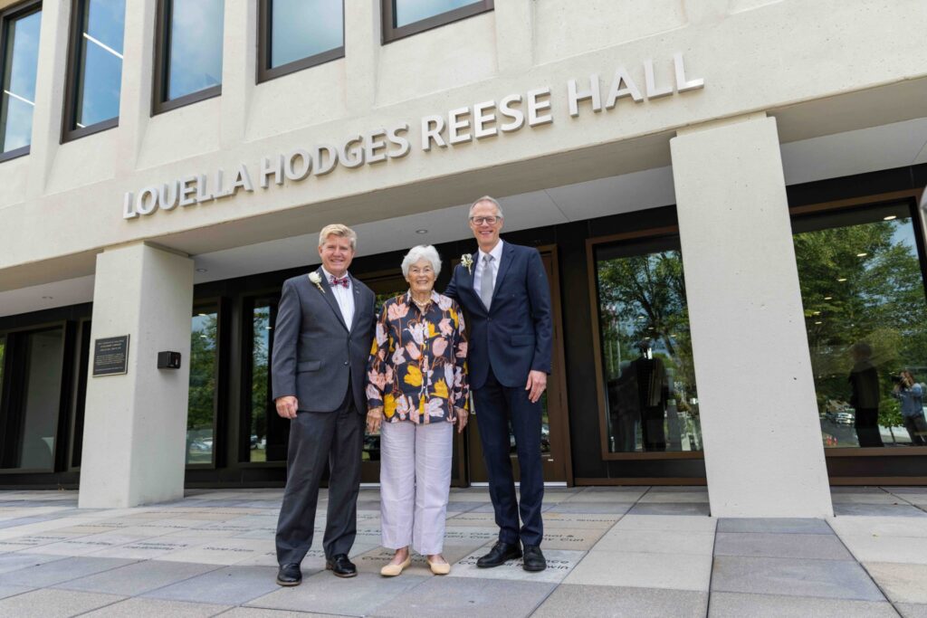 John Berry, Bill MacDonald, and Louella Hodges Reese posing outside building