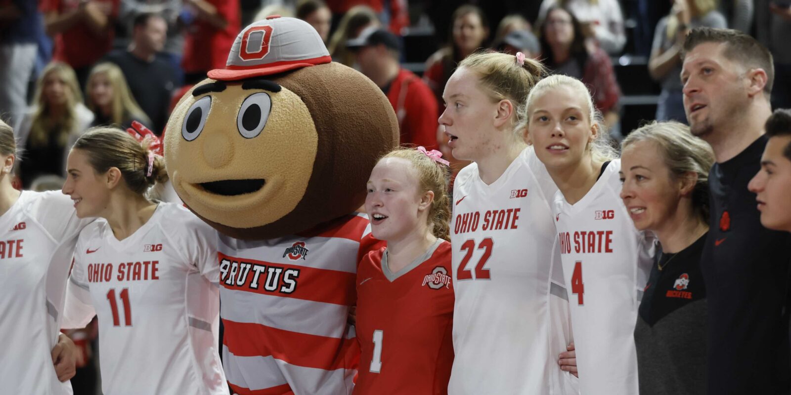 Sarah Morbitzer stands with Brutus the Buckeye and her Ohio State volleyball teammates