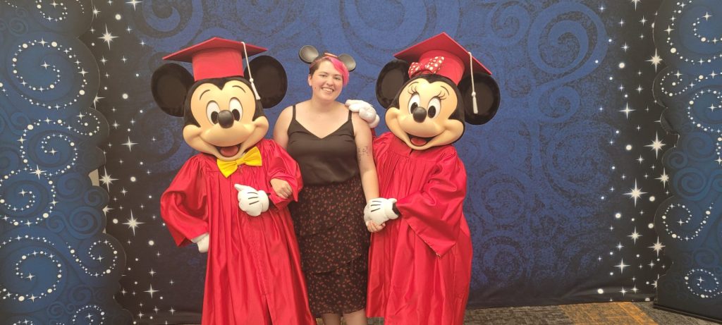 Danielle Johnson with graduation Mickey and Minnie Mouse